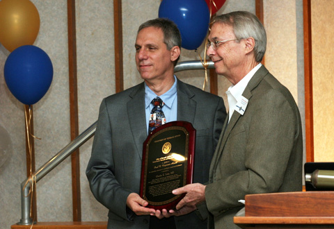 Photo of Dr. Levy receiving the Paul B. Magnuson Award from Dr. Nadeau